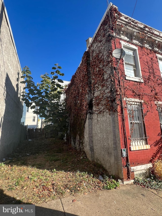 1745 W Seybert St, Philadelphia, PA 19121 - view of side of home featuring brick siding