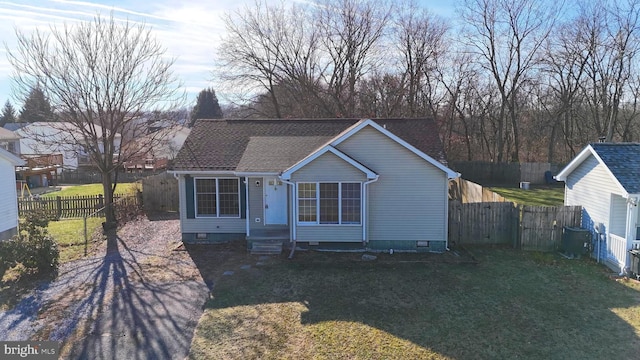 bungalow-style home with central AC unit and a front yard