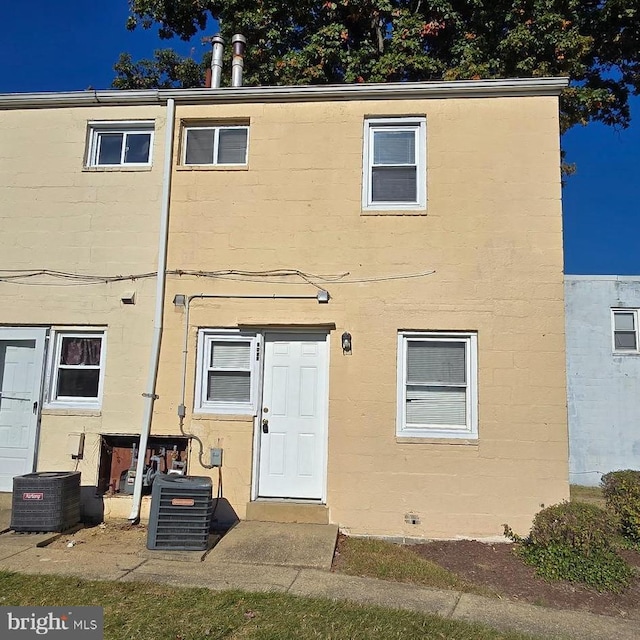 back of property featuring central air condition unit