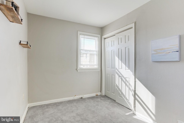 interior space featuring light carpet