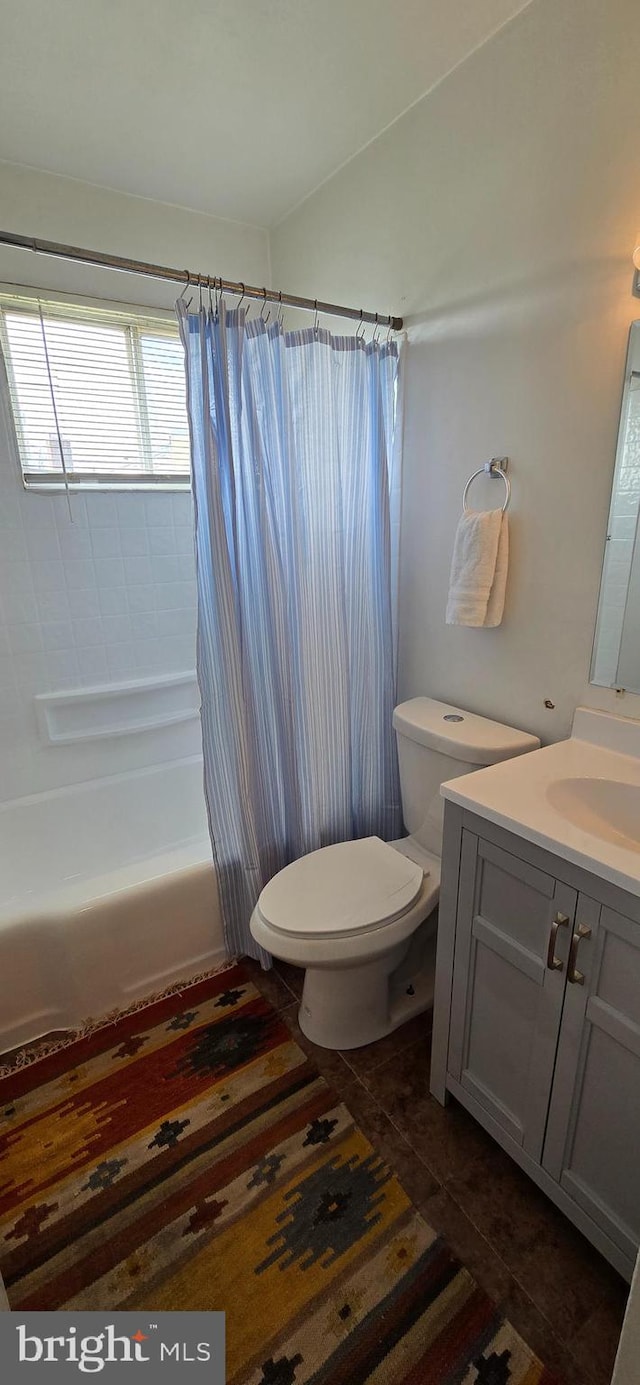 full bathroom featuring vanity, toilet, shower / bath combination with curtain, and tile patterned flooring