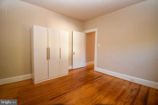 unfurnished bedroom with wood-type flooring