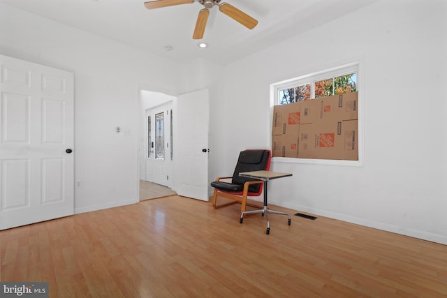 interior space with light wood-type flooring and ceiling fan