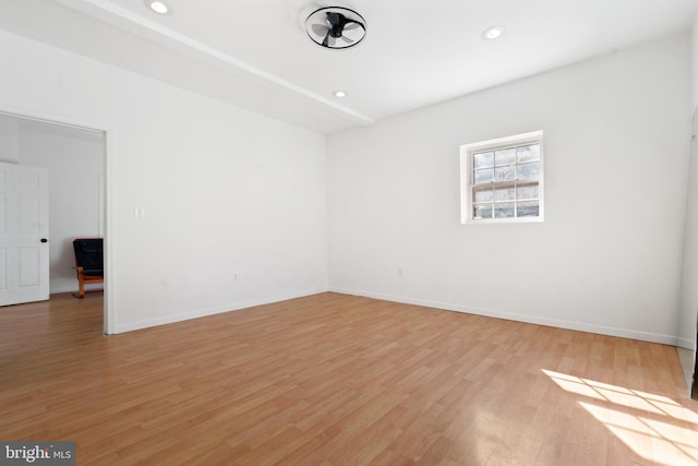 spare room with light hardwood / wood-style floors