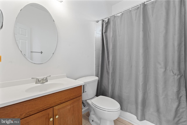 full bathroom featuring toilet, shower / bathtub combination with curtain, vanity, and tile patterned floors