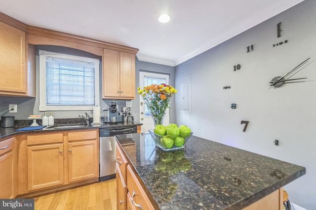 kitchen with stainless steel dishwasher, crown molding, sink, light hardwood / wood-style flooring, and dark stone countertops