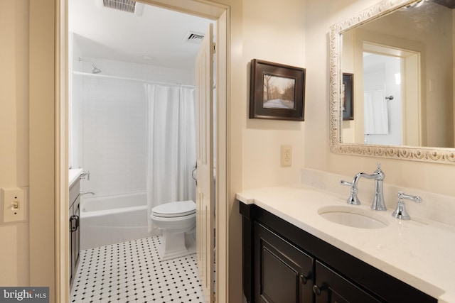 full bathroom featuring toilet, vanity, and shower / bathtub combination with curtain