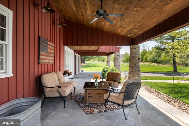 view of patio featuring ceiling fan