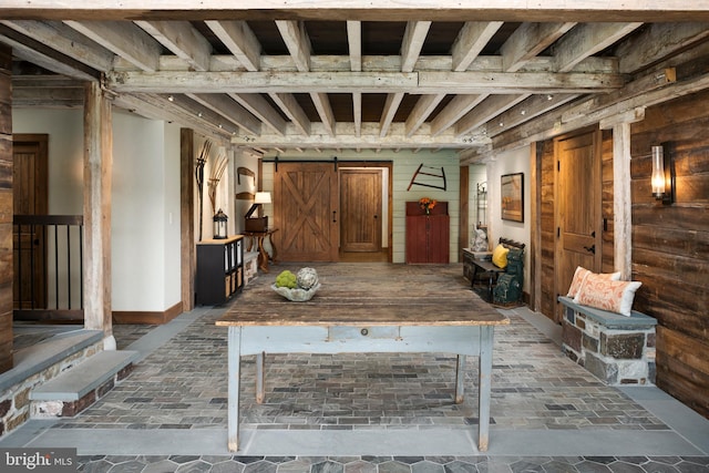 miscellaneous room with a barn door