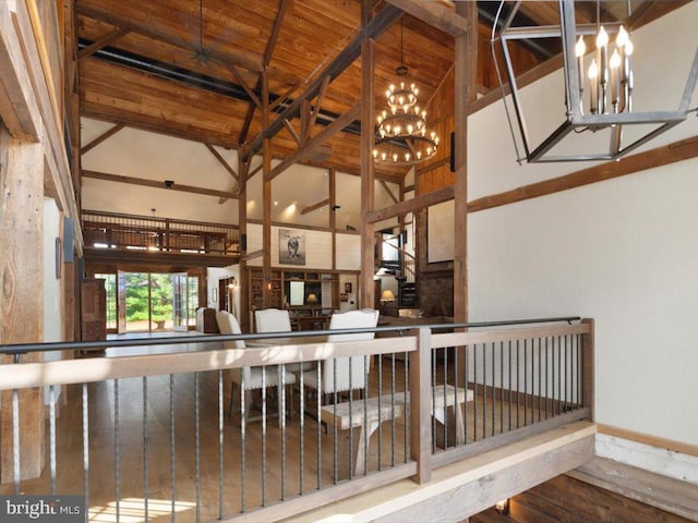 interior space featuring hardwood / wood-style floors, beam ceiling, wood ceiling, and high vaulted ceiling