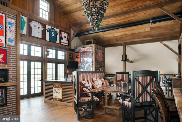 miscellaneous room with wooden ceiling, wood-type flooring, an inviting chandelier, and high vaulted ceiling