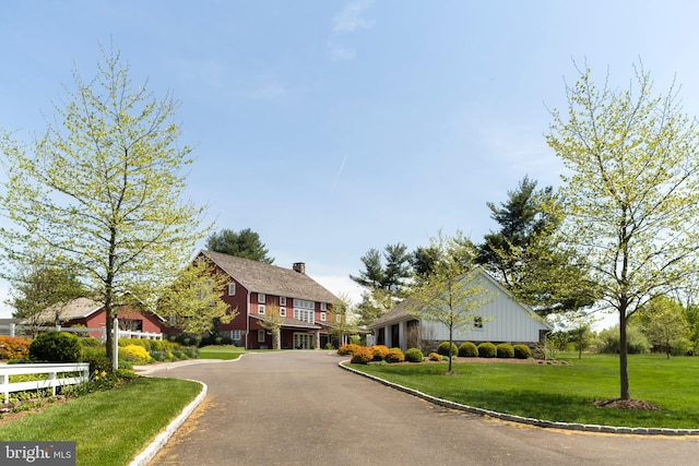 exterior space with a front lawn