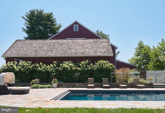 view of swimming pool featuring a patio