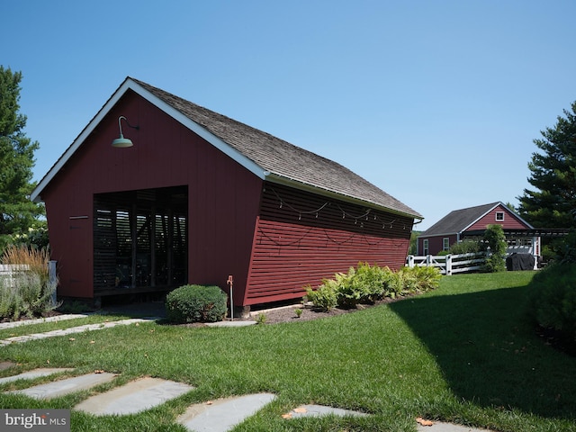 view of outdoor structure with a yard