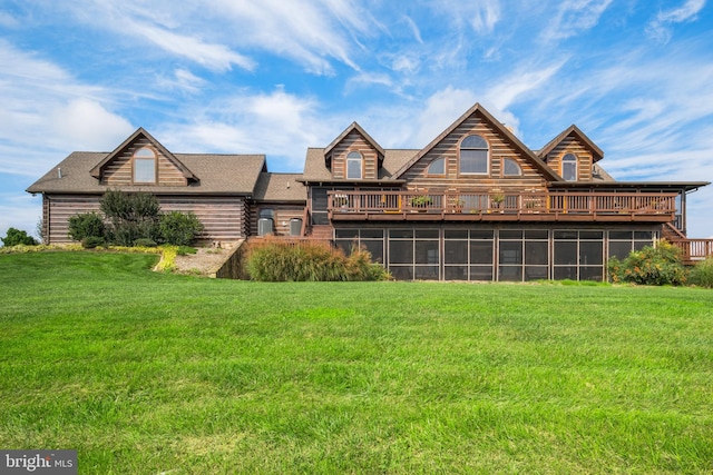 view of front of property with a front yard and a deck