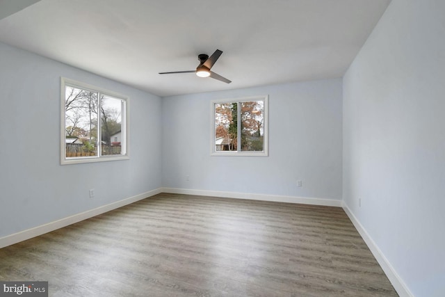 unfurnished room featuring hardwood / wood-style floors and ceiling fan