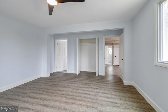 unfurnished room featuring ceiling fan and wood-type flooring