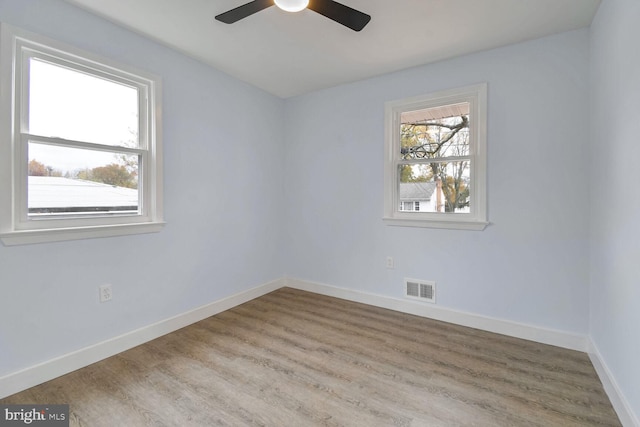 unfurnished room featuring ceiling fan and light wood-type flooring