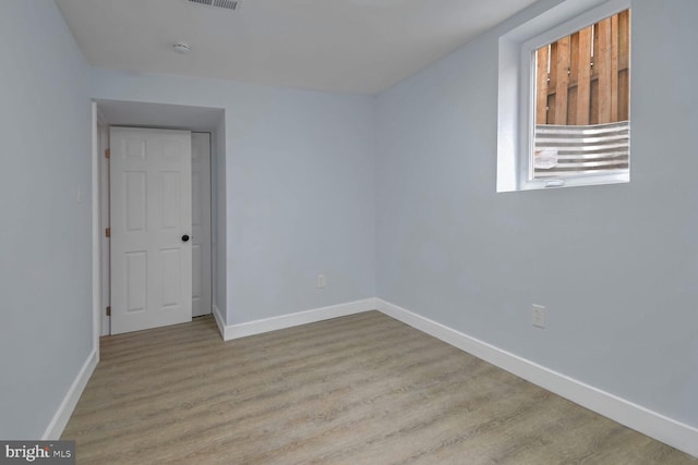 unfurnished room featuring light wood-type flooring