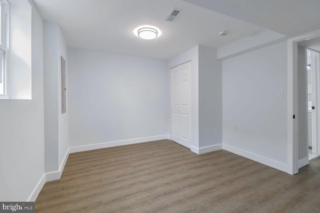 spare room featuring dark hardwood / wood-style floors