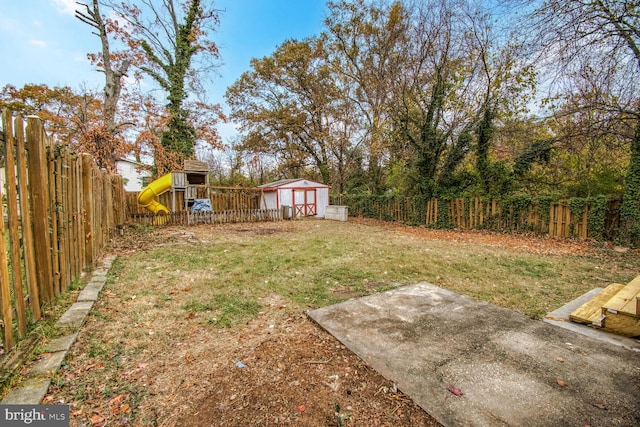 view of yard featuring a patio and an outdoor structure