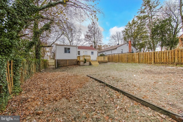 view of yard with a wooden deck