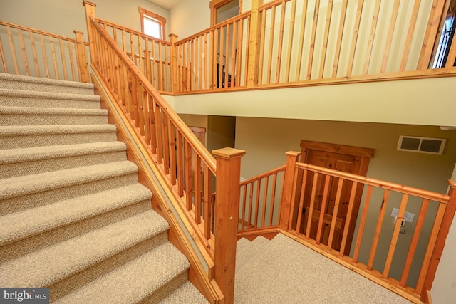 stairway with carpet flooring