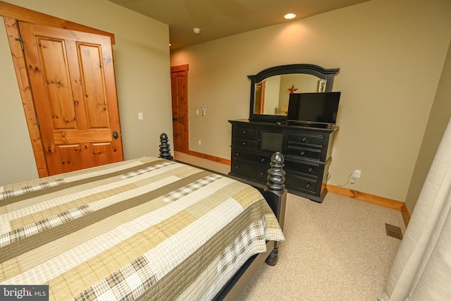 bedroom featuring light carpet