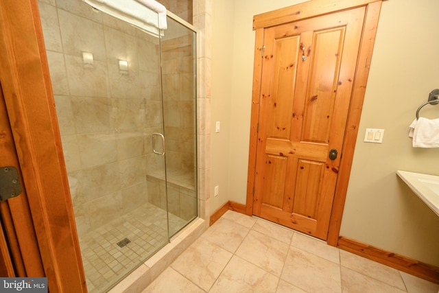 bathroom featuring tile patterned floors and walk in shower