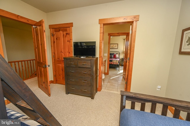 bedroom with light colored carpet