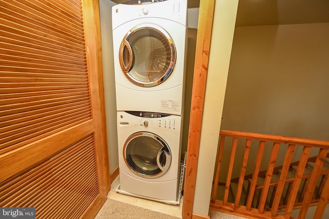 laundry room featuring stacked washing maching and dryer