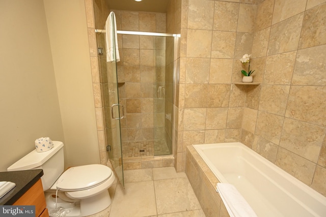 full bathroom featuring vanity, toilet, tile patterned floors, and separate shower and tub