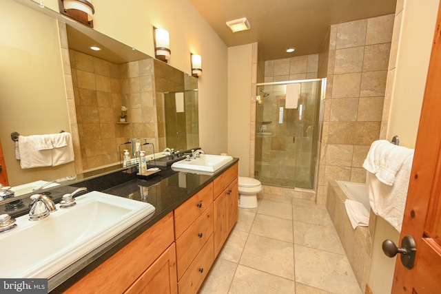 full bathroom featuring vanity, plus walk in shower, toilet, and tile patterned flooring