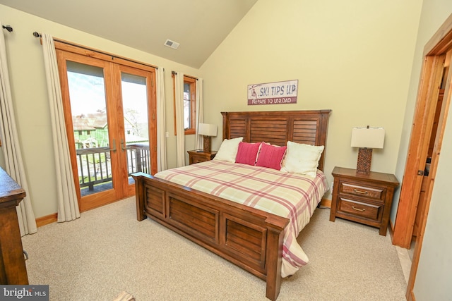 bedroom with lofted ceiling, french doors, access to exterior, and light colored carpet