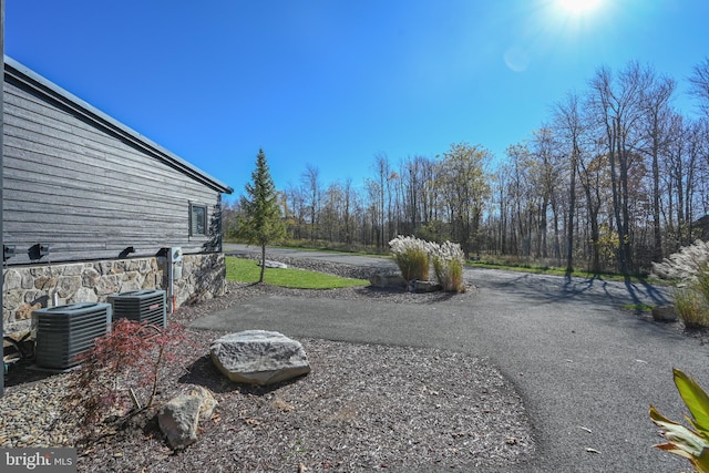 view of yard with central AC