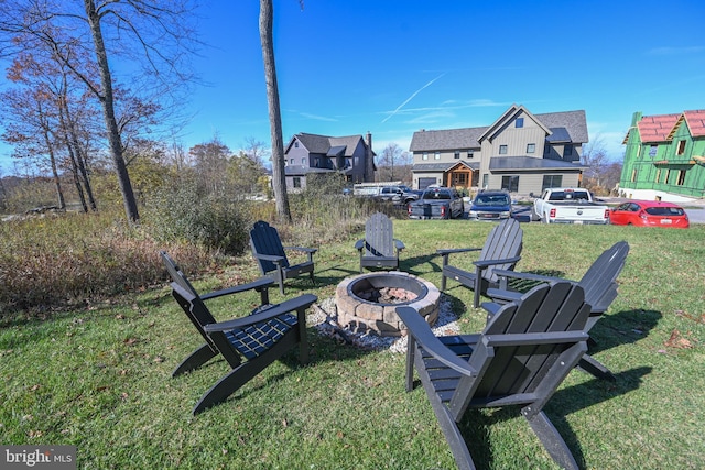 view of yard with a fire pit