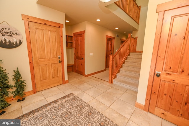 entryway featuring light tile patterned floors