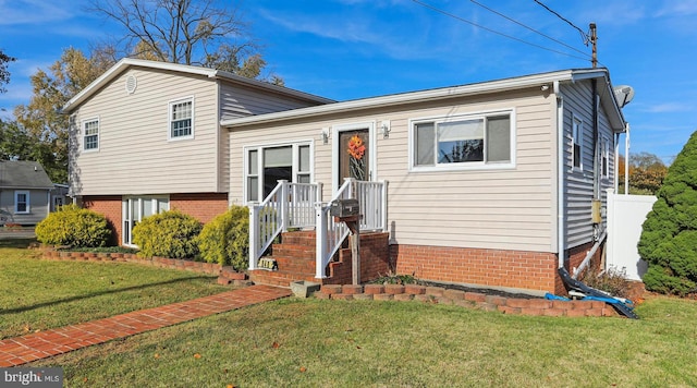 split level home with a front yard