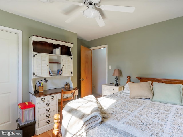 bedroom with ceiling fan and wood-type flooring