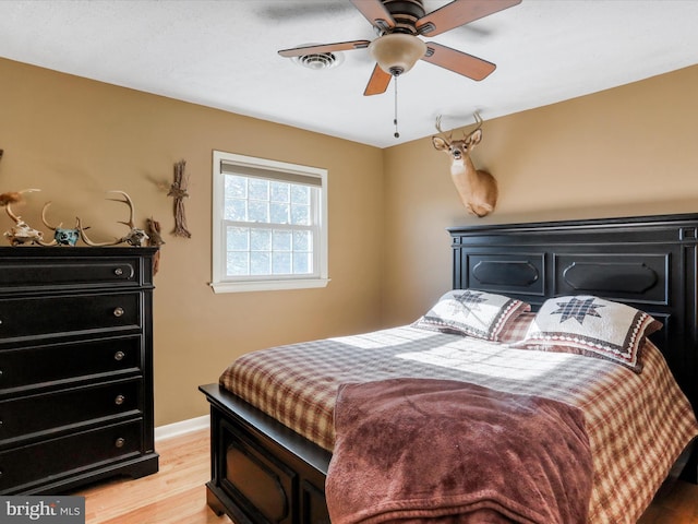 bedroom featuring light wood-type flooring and ceiling fan