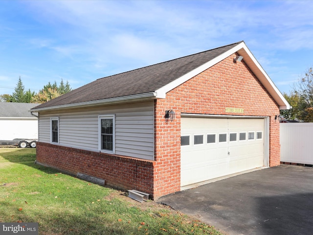 view of property exterior featuring a yard and a garage