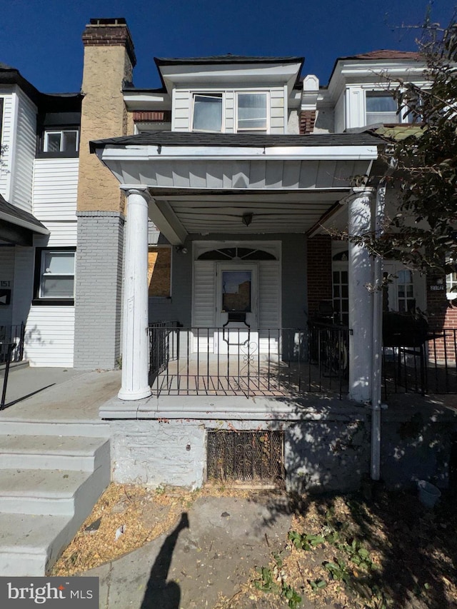 doorway to property featuring covered porch