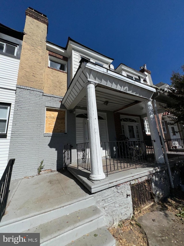 view of property exterior featuring a porch