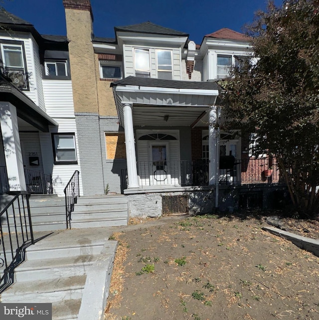 view of property with covered porch