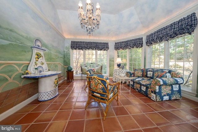 interior space with crown molding, a notable chandelier, a healthy amount of sunlight, and tile patterned flooring