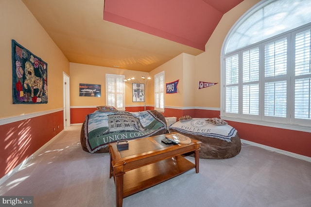 living room featuring carpet and lofted ceiling