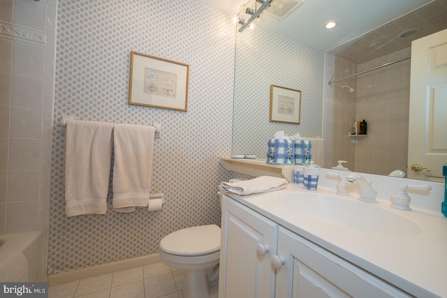 bathroom with vanity, toilet, and tile patterned floors