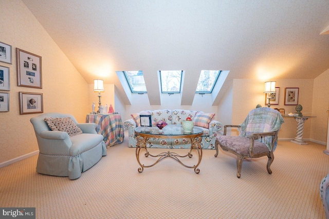 living area featuring lofted ceiling with skylight, carpet floors, and a healthy amount of sunlight