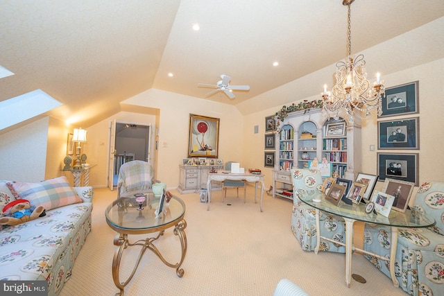 interior space featuring lofted ceiling with skylight, carpet flooring, and ceiling fan with notable chandelier