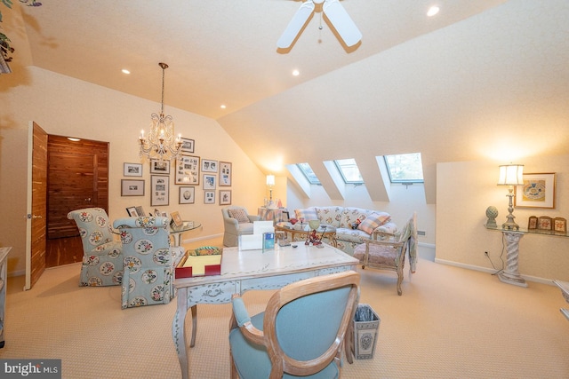 living room with ceiling fan with notable chandelier, lofted ceiling with skylight, and light colored carpet